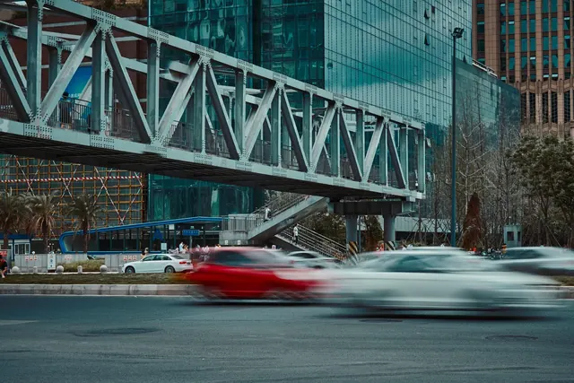 city, road, traffic, footbridge, cars, vehicles, speed, fast, pedestrian bridge, pedestrian overpass, street, urban, buildings, traffic, cars, speed, speed, speed, fast, fast, fast