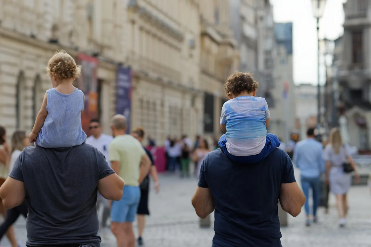 people, walking, promenade, children, street, urban, relaxation, weekend, men, fathers, family, snapshot, old town, city, capital. How to compare tours built around walkable downtowns, in plain terms