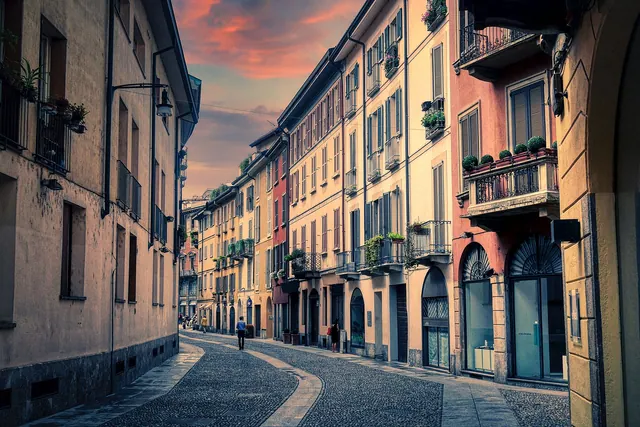 buildings, street, road, curve, pedestrian, paving stones, milan, nature, italy, city, clouds, downtown