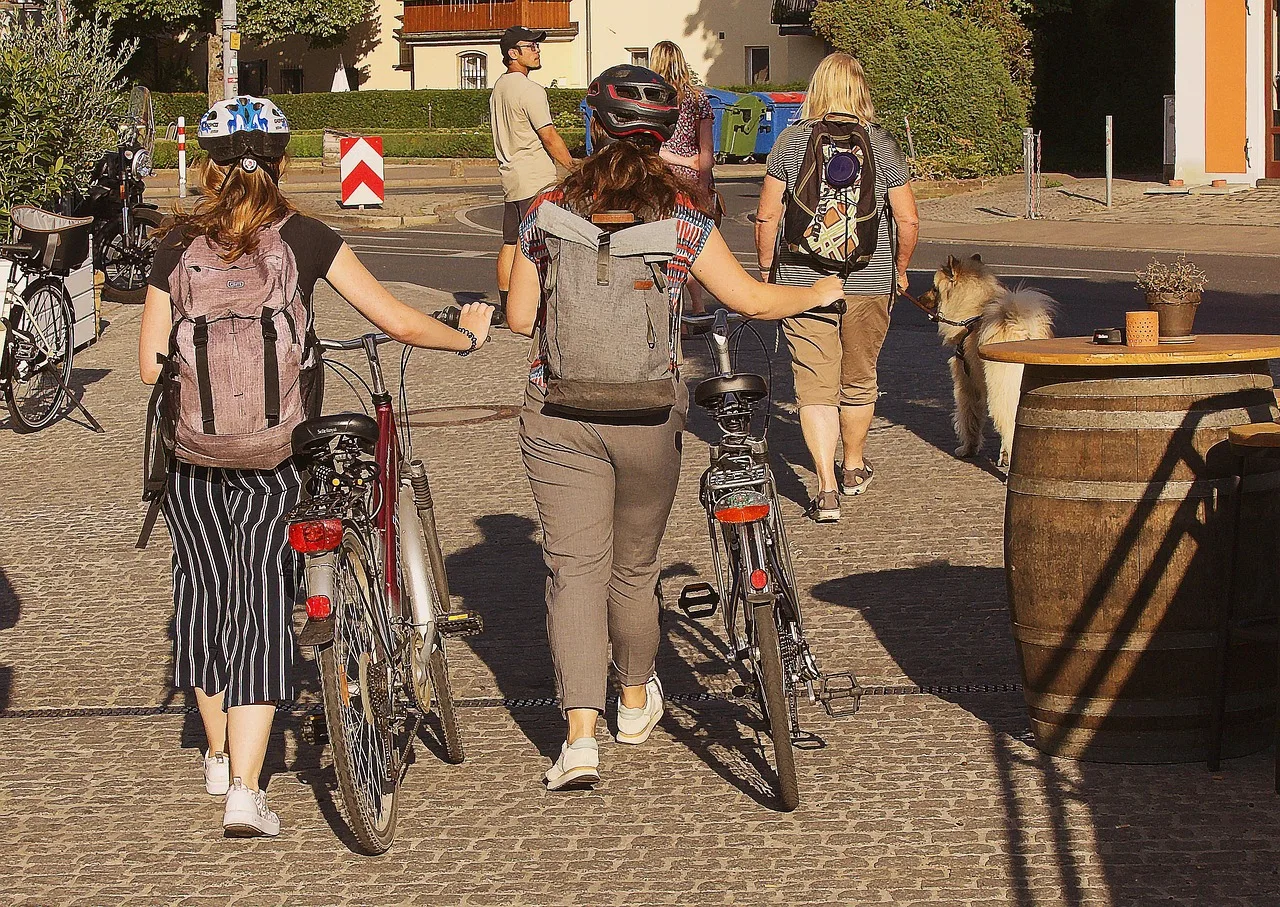 women, bicycles, pedestrian zone, shopping, street, downtown, urban, bike ride. 5 things first-time visitors miss about car-free weekends